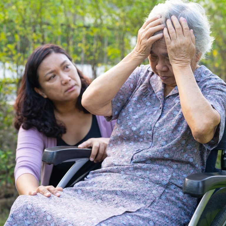 asian-elderly-woman-headache-while-sitting-on-whee-2026-03-25-09-14-10-utc (1)